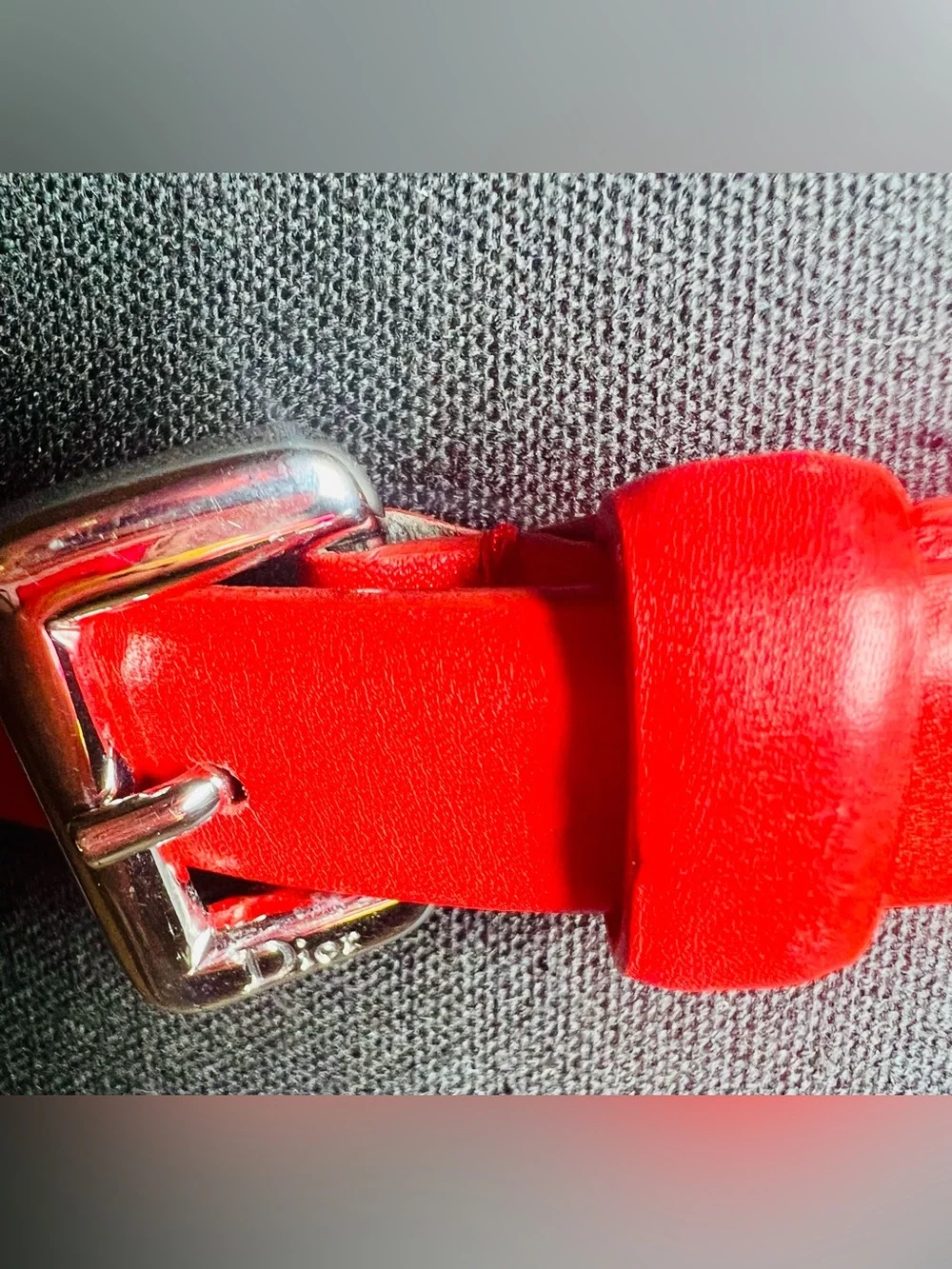 Christian Dior vibrant red leather w/ silver tone pin buckle. EUC 26-29”